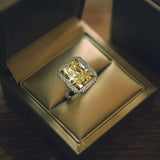 18K Gold Ring With a Radiant Cut Diamond and Natural Round White Diamonds